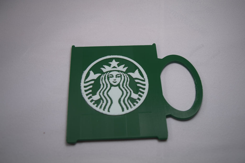 Starbucks Mug Gift Card Holder, green 3D-printed plastic with a white Starbucks logo.