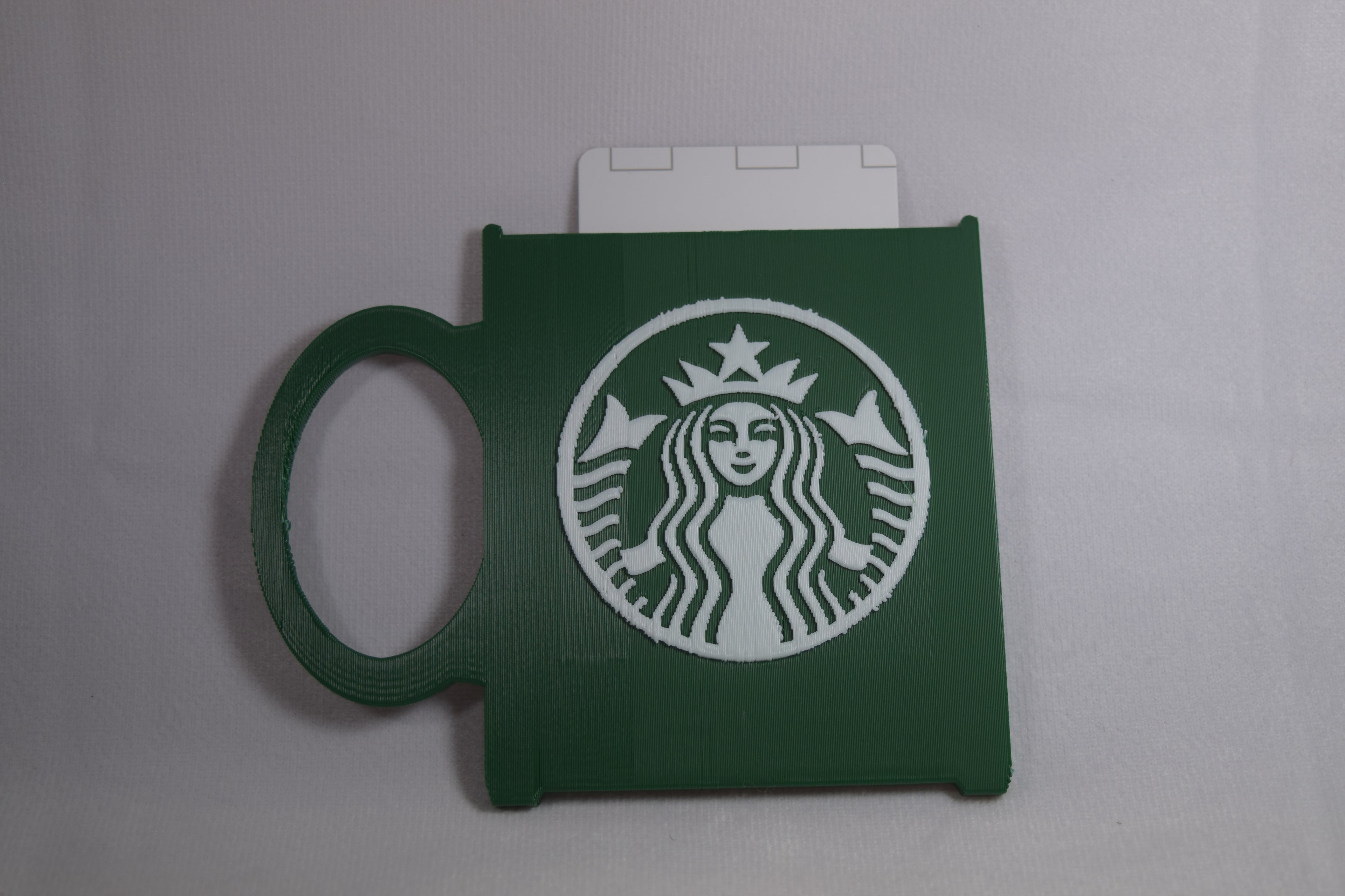 Starbucks mug gift card holder in green with white Starbucks logo