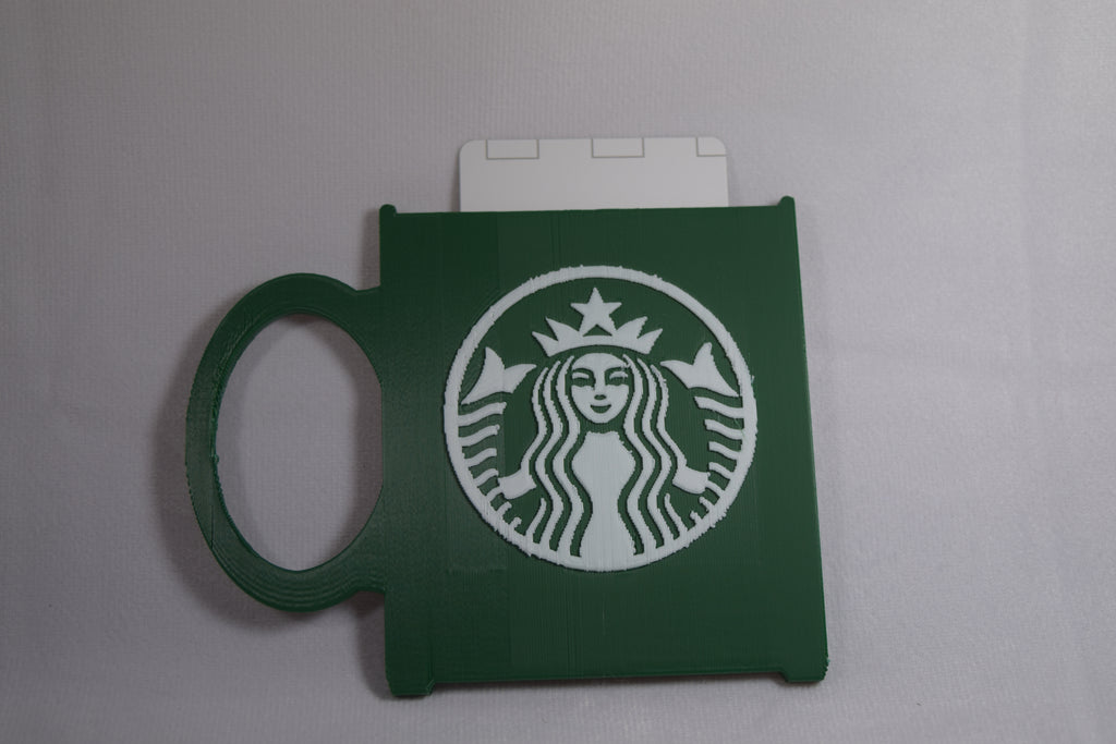 Starbucks mug gift card holder, green with white Starbucks logo.