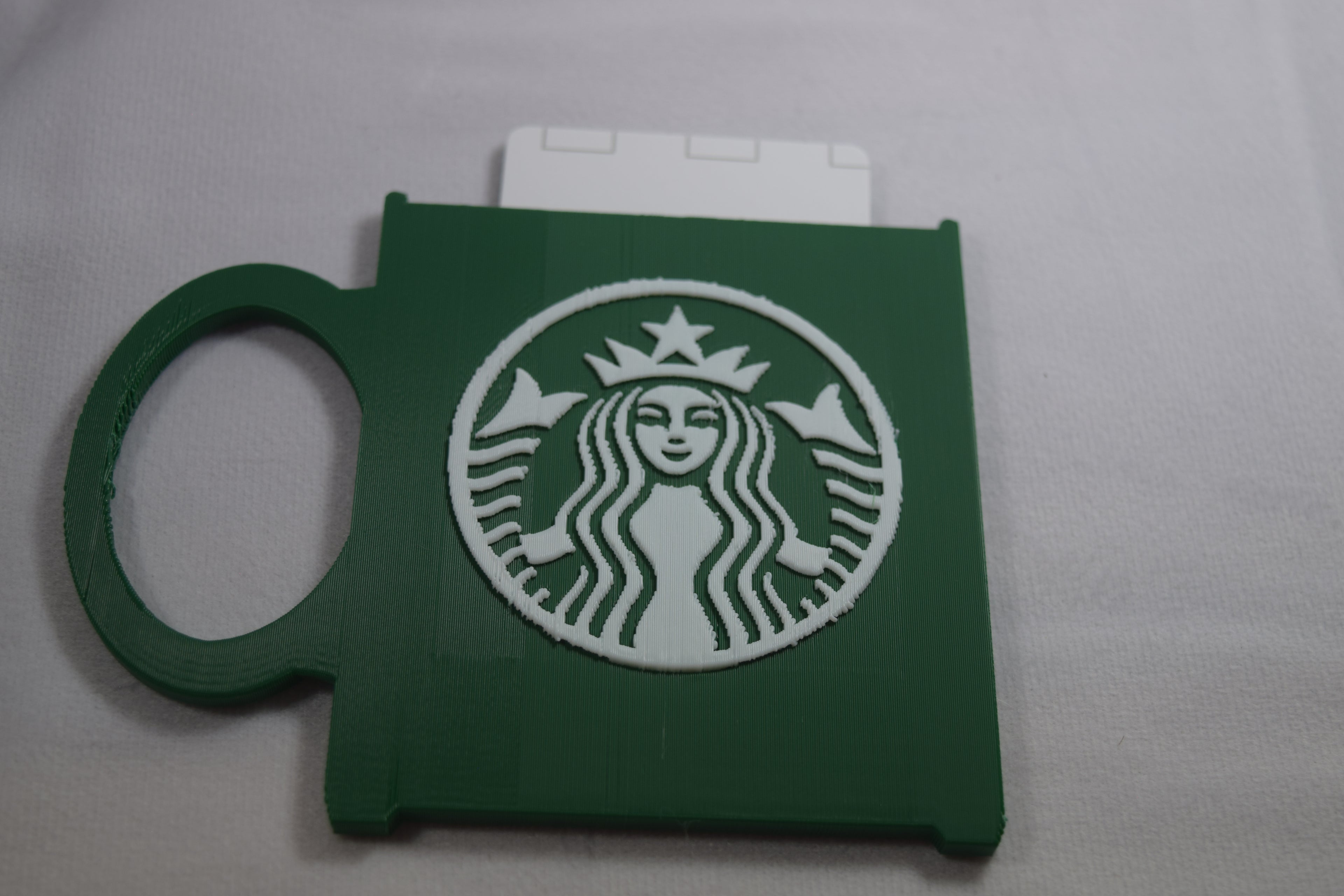 Starbucks Mug Gift Card Holder, green 3D-printed accessory with white Starbucks logo