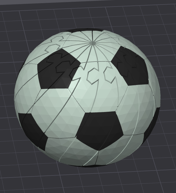 Soccer ball fidget toy, light gray with black panels, pocket-sized