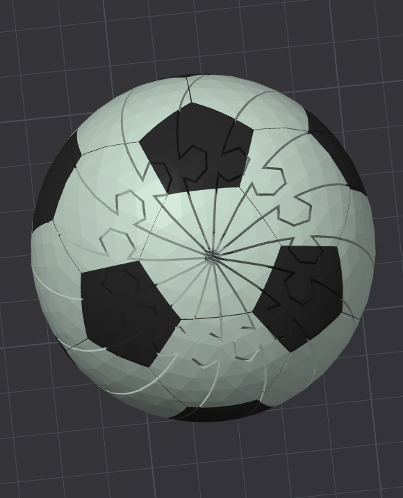 Soccer Twisty Slime Fidget toy, pocket-sized 3D-printed soccer ball with black and light-gray panels.