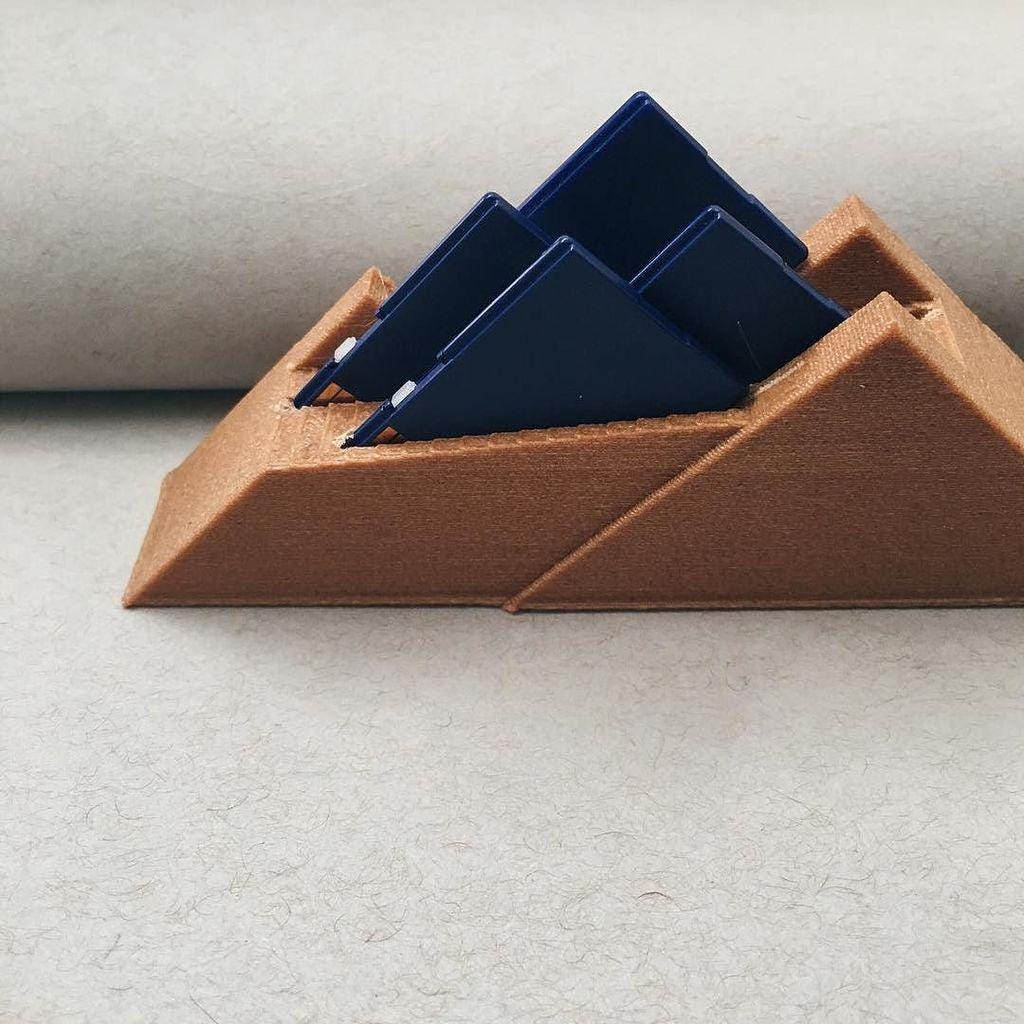 SD Card Mountain decorative holder; brown 3D-printed base with three dark blue SD cards
